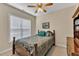 Cozy bedroom features a ceiling fan, neutral walls, and a comfortable double bed, making it a relaxing retreat at 202 Reeder Branch Dr, Clayton, NC 27520