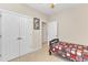 Carpeted bedroom features a ceiling fan, double closet, and a cozy atmosphere, ideal for rest and relaxation at 202 Reeder Branch Dr, Clayton, NC 27520