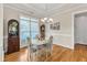 Charming dining room features a window and hardwood floors at 202 Reeder Branch Dr, Clayton, NC 27520