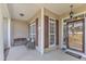 Comfortable covered front porch with seating, decorative pillows, and charming views of the front yard at 202 Reeder Branch Dr, Clayton, NC 27520