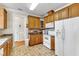 Traditional kitchen with white appliances and tile floors at 202 Reeder Branch Dr, Clayton, NC 27520