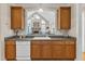Kitchen with wood cabinets and a view to the living room at 202 Reeder Branch Dr, Clayton, NC 27520