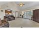 Open living room with tile floors and a ceiling fan at 202 Reeder Branch Dr, Clayton, NC 27520
