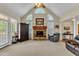 Bright living room with fireplace and ceiling fan at 202 Reeder Branch Dr, Clayton, NC 27520