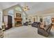 Open concept living room with hardwood floors and a fireplace at 202 Reeder Branch Dr, Clayton, NC 27520