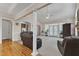 Open-concept living room with hardwood floors, a fireplace, and access to a backyard with natural light at 202 Reeder Branch Dr, Clayton, NC 27520