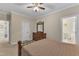 Spacious main bedroom with carpet flooring, neutral walls, and a large wooden dresser at 202 Reeder Branch Dr, Clayton, NC 27520
