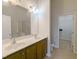 Modern bathroom with double vanity, tile flooring, glass-enclosed shower, and access to the closet at 204 Stockton Gorge Rd. Rd, Morrisville, NC 27560
