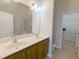 Well-lit bathroom with double sink vanity, tile flooring, and glass-enclosed shower and toilet at 204 Stockton Gorge Rd. Rd, Morrisville, NC 27560