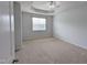 Comfortable carpeted bedroom with ceiling fan and window offering natural light and privacy at 204 Stockton Gorge Rd. Rd, Morrisville, NC 27560