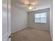 Bedroom with neutral carpet, ceiling fan, and a window with blinds, creating a cozy space at 204 Stockton Gorge Rd. Rd, Morrisville, NC 27560