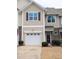 Charming townhouse boasts a single-car garage, well-maintained landscaping, and traditional architectural details at 204 Stockton Gorge Rd. Rd, Morrisville, NC 27560