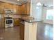 Modern kitchen with stainless steel appliances, granite countertops, and ample cabinet space, open to the living area at 204 Stockton Gorge Rd. Rd, Morrisville, NC 27560