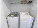 Laundry room with a side-by-side washer and dryer, and white wire shelving above at 204 Stockton Gorge Rd. Rd, Morrisville, NC 27560