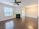Bright living room features a fireplace, hardwood floors, and sliding doors for outdoor access at 204 Stockton Gorge Rd. Rd, Morrisville, NC 27560