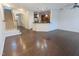 Spacious living room with hardwood floors open to the kitchen and staircase with access to the upper level at 204 Stockton Gorge Rd. Rd, Morrisville, NC 27560