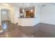 Open concept living area features hardwood flooring, a breakfast bar, and a kitchen with modern appliances at 204 Stockton Gorge Rd. Rd, Morrisville, NC 27560