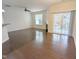 Bright living room with hardwood floors, fireplace, and sliding glass doors to the outdoor patio area at 204 Stockton Gorge Rd. Rd, Morrisville, NC 27560