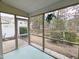 Enclosed porch with green flooring and screen walls, offers a view of the backyard at 204 Stockton Gorge Rd. Rd, Morrisville, NC 27560