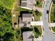 An aerial view of a home featuring a well-manicured lawn and a long driveway on a sunny day at 208 Willowbend Ln, Hillsborough, NC 27278
