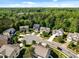 A beautiful neighborhood with well-maintained homes surrounded by lush greenery and mature trees at 208 Willowbend Ln, Hillsborough, NC 27278
