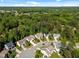 A picturesque neighborhood featuring beautiful homes surrounded by a lush green forest at 208 Willowbend Ln, Hillsborough, NC 27278