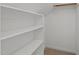 Walk-in closet featuring built-in shelving at 208 Willowbend Ln, Hillsborough, NC 27278
