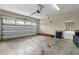 A large garage featuring an automatic door, utility door, and ladder at 208 Willowbend Ln, Hillsborough, NC 27278