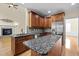 Spacious kitchen with granite countertops, stainless steel appliances, and a center island at 208 Willowbend Ln, Hillsborough, NC 27278