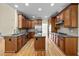 Spacious kitchen with granite countertops, stainless steel appliances, and rich wood cabinets at 208 Willowbend Ln, Hillsborough, NC 27278