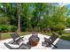 This backyard is perfect for entertaining, with a fire pit and comfortable seating at 2104 Manuel St, Raleigh, NC 27612