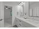 A gorgeous primary bathroom features a dual sink vanity and black fixtures at 2104 Manuel St, Raleigh, NC 27612