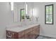 Modern bathroom with a double sink vanity, quartz countertop, and stylish faucets and lighting at 2104 Manuel St, Raleigh, NC 27612