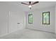 This modern bedroom features recessed lighting, a ceiling fan, and windows that bring in natural light at 2104 Manuel St, Raleigh, NC 27612