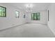 This large bonus room features several windows, recessed lighting, and neutral paint at 2104 Manuel St, Raleigh, NC 27612