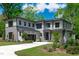 Stunning two-story home boasts a modern design, professional landscaping, and attached garage at 2104 Manuel St, Raleigh, NC 27612