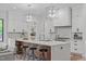 Gourmet kitchen with large island, sleek cabinetry, quartz counters, and geometric backsplash at 2104 Manuel St, Raleigh, NC 27612
