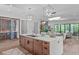 Open-concept kitchen with a large island, modern lighting, and stainless steel appliances at 2104 Manuel St, Raleigh, NC 27612