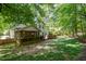 Backyard with a deck and screened porch offering ample space for relaxation and entertainment at 215 Hopesworth Ct, Hillsborough, NC 27278