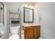 Cozy bathroom featuring a toilet, a vanity, and a shelf at 215 Hopesworth Ct, Hillsborough, NC 27278