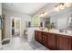 The bathroom features a double vanity, a soaking tub, and a walk-in closet at 215 Hopesworth Ct, Hillsborough, NC 27278