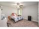 Bedroom featuring neutral walls and carpet, a ceiling fan, and a window at 215 Hopesworth Ct, Hillsborough, NC 27278