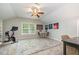 Bonus room with a ceiling fan, a colorful rug, and a desk with seating at 215 Hopesworth Ct, Hillsborough, NC 27278