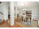 Elegant dining room with detailed trim, a chandelier, and seamless access to other living spaces at 215 Hopesworth Ct, Hillsborough, NC 27278
