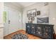 Foyer with hardwood floors, stylish decor, and ample natural light, creating a warm entrance at 215 Hopesworth Ct, Hillsborough, NC 27278