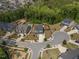 Aerial shot of a neighborhood showcasing the house's location with a pool, backyard, and surrounding trees at 221 Obsidian Dr, Holly Springs, NC 27540