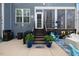 Charming back patio with outdoor seating and a screened-in porch, perfect for relaxing and entertaining at 221 Obsidian Dr, Holly Springs, NC 27540