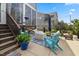 Cozy back patio with comfortable seating and a charming screened porch, great for outdoor relaxation at 221 Obsidian Dr, Holly Springs, NC 27540