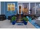 Backyard with stairs to porch. Potted plants add color to the entrance at 221 Obsidian Dr, Holly Springs, NC 27540
