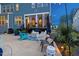 Relaxing backyard patio area with stylish furniture and cozy screened-in porch at 221 Obsidian Dr, Holly Springs, NC 27540